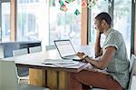 Man working on laptop in office