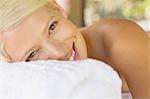 Close up of woman smiling on massage table
