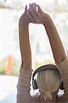 Woman stretching in headphones