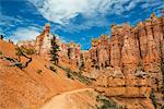 Sandstone pillars and a road through the desert.