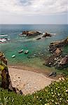 View from the clifftops onto the rocky shore and headlands of the Atlantic coastline.