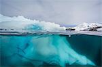 Above and below view of glacial ice near Wiencke Island, Neumayer Channel, Antarctica, Polar Regions