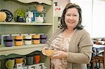 Portrait of mature female business owner in cafe