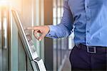 Cropped image of businessman typing in office security code office window