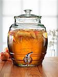 Glass barrel with tap dispenser containing fresh apple drink