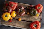 Selection of heirloom tomatoes on wooden board