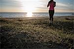 Young Girl Running On The Beach