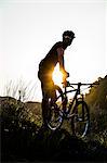 Man riding mountain bike in nature in the Bologna countryside, Italy