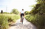 Cyclist cycling on path