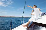 Parents and three sons sailing on catamaran near Fuerteventura, Spain