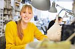 Female potter working in ceramic workshop