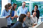 Businesspeople meeting around desk