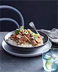 Bowl of butternut and pumpkin curry on steamed rice