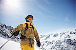 Low angle view of mid adult male skier on mountain, Austria