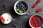 Fresh blueberries and redcurrants in bowls