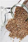 Buckwheat falling out of an overturned storage jar