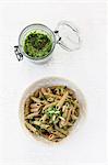 Wholemeal penne pasta with wild garlic pesto and pine nuts