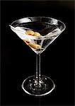 A martini against a black background