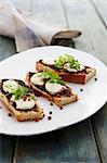 Crispy white bread with olive tapenade and mozzarella