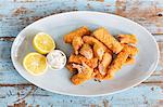 Salmon fish fingers with tartare sauce and lemon