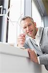Businessman looking wind turbine