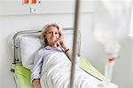 Patient in hospital phoning from bed