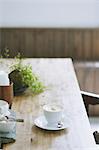 Cappuccino on wooden table in a cafe