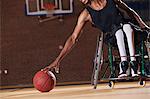 Man who had Spinal Meningitis in wheelchair reaching for basketball