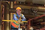 Engineer in electric power plant condenser room