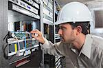 Network engineer working in a server room