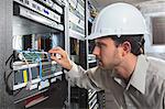 Network engineer working in a server room