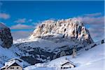 Houses on mountainside, Saslong and Sella Group, Val Gardena, Bolzano District, Trentino Alto Adige, Dolomites, Italy