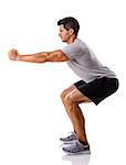 Athletic man running doing squats, isolated over a white background