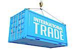 International Trade - Blue Cargo Container hoisted with hook Isolated on White Background.
