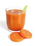 glass with carrot juice on white background