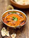 close up of a bowl of rustic indian chicken curry