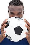 Close up portrait of a serious football player over white background