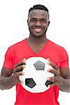 Portrait of a smiling handsome football fan over white background