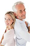 Side view portrait of happy mature couple over white background