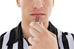 Close up mid section of referee blowing whistle on white background