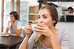 Pretty blonde enjoying a coffee at the coffee shop