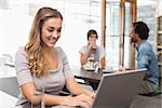 Pretty blonde using her laptop at the coffee shop