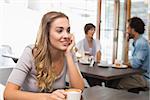 Pretty blonde enjoying a coffee at the coffee shop