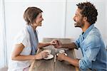 Casual couple having coffee together at the coffee shop