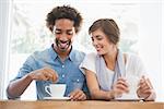 Casual couple having coffee together at the coffee shop