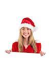 Pretty santa girl smiling at camera with poster on white background