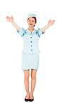 Pretty air hostess with arms raised on white background