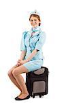 Pretty air hostess smiling at camera on white background
