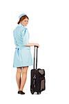 Pretty air hostess leaning on suitcase on white background