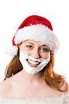 Festive redhead in foam beard on white background